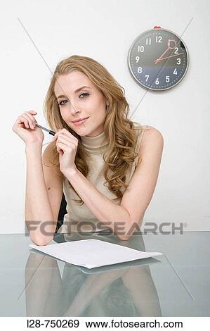 Stock Photo - Businesswoman holding a pen. Fotosearch
