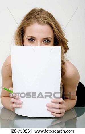 Businesswoman holding blank sign at camera View Large Photo Image Stock Image - Businesswoman holding blank sign at camera. Fotosearch