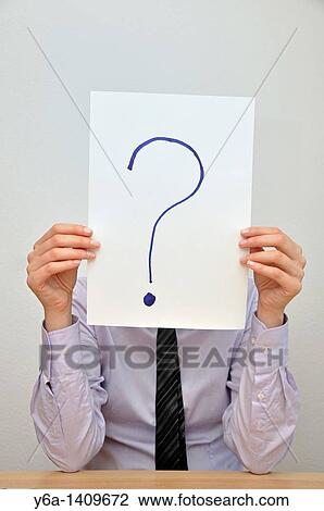 Businesswoman holding card with question mark in front of face View Large Photo Image Stock Image - Businesswoman holding card with question mark in front of face. Fotosearch
