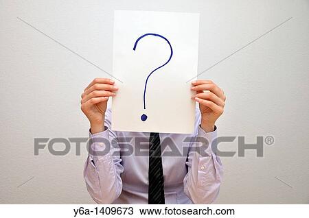 Businesswoman holding card with question mark in front of face View Large Photo Image Stock Image - Businesswoman holding card with question mark in front of face. Fotosearch