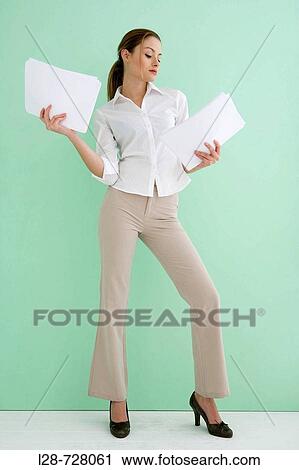 Stock Image - businesswoman holding document. Fotosearch