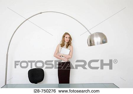 businesswoman holding laptop, portrait View Large Photo Image Stock Photograph - businesswoman holding laptop, portrait. Fotosearch