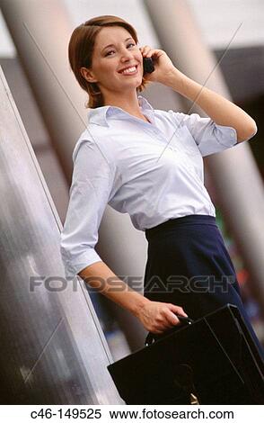 Businesswoman on cell phone View Large Photo Image Stock Photography - Businesswoman on cell phone. Fotosearch