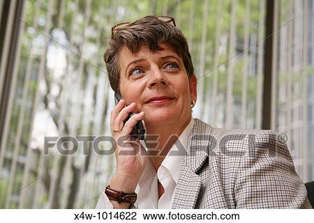 Businesswoman on mobile phone View Large Photo Image Stock Image - Businesswoman on mobile phone. Fotosearch