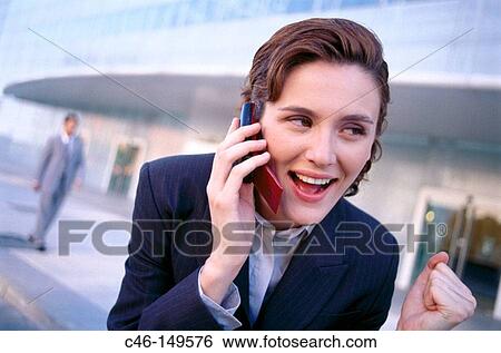 Businesswoman talking on cell phone View Large Photo Image Stock Photograph - Businesswoman talking on cell phone. Fotosearch
