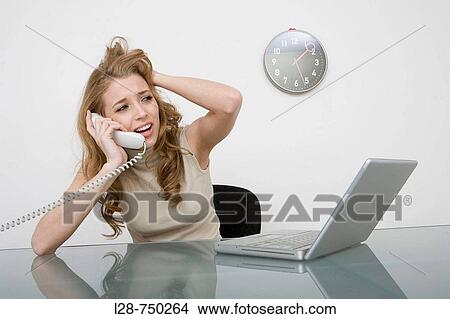 Businesswoman talking on telephone View Large Photo Image Picture - Businesswoman talking on telephone. Fotosearch