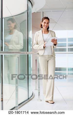 Businesswoman using digital tablet View Large Photo Image Picture - Businesswoman using digital tablet. Fotosearch