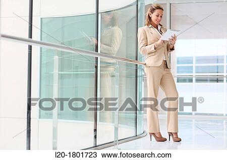 Businesswoman using digital tablet View Large Photo Image Stock Image - Businesswoman using digital tablet. Fotosearch
