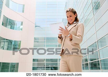 Businesswoman using digital tablet View Large Photo Image Stock Image - Businesswoman using digital tablet. Fotosearch