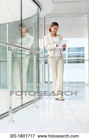 Businesswoman using digital tablet View Large Photo Image Stock Photo - Businesswoman using digital tablet. Fotosearch