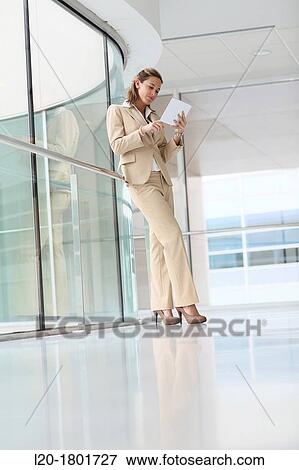 Businesswoman using digital tablet View Large Photo Image Stock Photo - Businesswoman using digital tablet. Fotosearch
