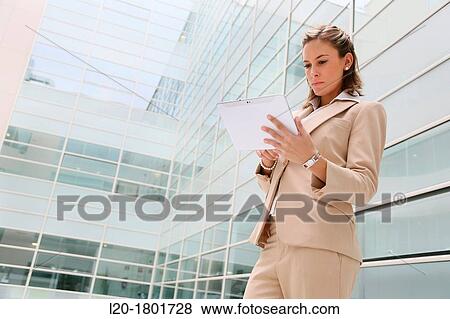 Businesswoman using digital tablet View Large Photo Image Stock Photo - Businesswoman using digital tablet. Fotosearch