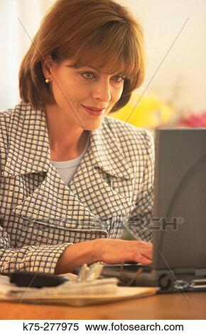 businesswoman using her laptop View Large Photo Image Stock Photography - businesswoman using her laptop. Fotosearch