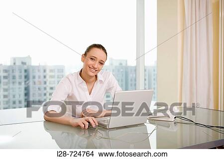businesswoman using laptop View Large Photo Image Picture - businesswoman using laptop. Fotosearch