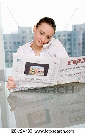 Businesswoman using telephone in office View Large Photo Image Stock Image - Businesswoman using telephone in office. Fotosearch