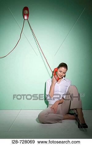 Stock Photo - businesswoman using telephone. Fotosearch