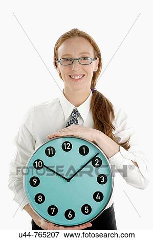 Businesswoman with wall clock View Large Photo Image Stock Photo - Businesswoman with wall clock. Fotosearch
