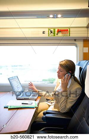Businesswoman working connected to the internet. Passenger. AVE, Tren de Alta Velocidad, Zaragoza, Arag? n. Spain. View Large Photo Image Stock Image - Businesswoman working connected to the internet. Passenger. AVE, Tren de Alta Velocidad, Zaragoza, Arag? n. Spain.. Fotosearch