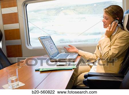 Businesswoman working connected to the internet. Passenger. AVE, Tren de Alta Velocidad, Zaragoza, Arag? n. Spain. View Large Photo Image Stock Image - Businesswoman working connected to the internet. Passenger. AVE, Tren de Alta Velocidad, Zaragoza, Arag? n. Spain.. Fotosearch