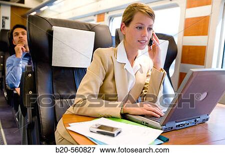 Businesswoman working connected to the internet. Passenger. AVE, Tren de Alta Velocidad, Zaragoza, Arag? n. Spain. View Large Photo Image Stock Photo - Businesswoman working connected to the internet. Passenger. AVE, Tren de Alta Velocidad, Zaragoza, Arag? n. Spain.. Fotosearch