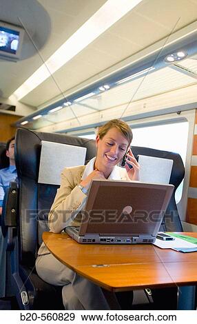 Businesswoman working connected to the internet. Passenger. AVE, Tren de Alta Velocidad, Zaragoza, Arag? n. Spain. View Large Photo Image Stock Photo - Businesswoman working connected to the internet. Passenger. AVE, Tren de Alta Velocidad, Zaragoza, Arag? n. Spain.. Fotosearch