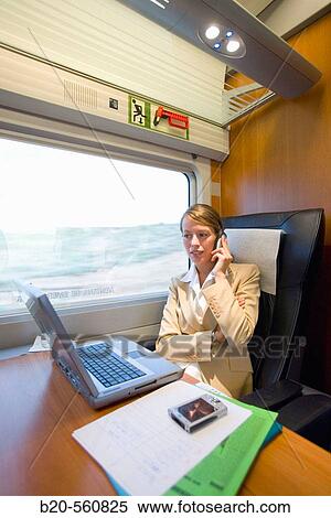Businesswoman working connected to the internet. Passenger. AVE, Tren de Alta Velocidad, Zaragoza, Arag? n. Spain. View Large Photo Image Stock Photography - Businesswoman working connected to the internet. Passenger. AVE, Tren de Alta Velocidad, Zaragoza, Arag? n. Spain.. Fotosearch