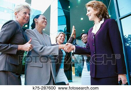businesswomen congratulating each other View Large Photo Image Stock Image - businesswomen congratulating each other. Fotosearch