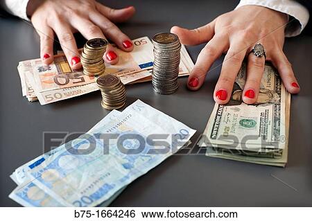 bussines, news paper, manos de mujer, manos contando, euros, moneda europea, moneda comunitaria, dinero, dolares, dolar usa, moneda, divisa, primer plano, valor, economia, cotizacion, mercado, compra venta, moneda extranjera View Large Photo Image Stock Photograph - bussines, news paper, manos de mujer, manos contando, euros, moneda europea, moneda comunitaria, dinero, dolares, dolar usa, moneda, divisa, primer plano, valor, economia, cotizacion, mercado, compra venta, moneda extranjera. Fotosearch