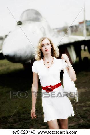 Bussiness woman in front a military russian plane View Large Photo Image Stock Image - Bussiness woman in front a military russian plane. Fotosearch