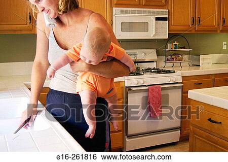 Busy mother View Large Photo Image Stock Photograph - Busy mother. Fotosearch