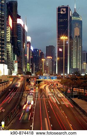 Stock Photo - Busy street at early evening at Causeway Bay, Central, Hong Kong Island, Hong Kong, China, Southeast Asia. Fotosearch