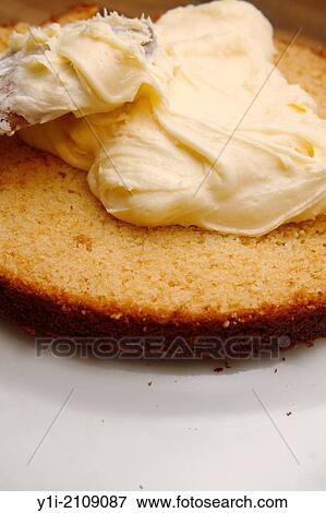buttercream being spread on lemon curd cake. View Large Photo Image Stock Photo - buttercream being spread on lemon curd cake.. Fotosearch