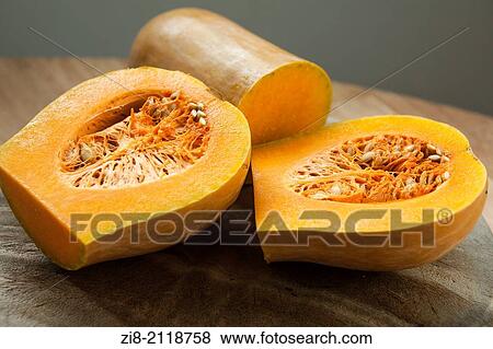 Stock Photo - Butternut squash (Cucurbita moschata)-cut in half.. Fotosearch