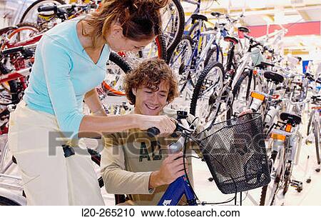 Buying a bicycle at shopping center View Large Photo Image Stock Image - Buying a bicycle at shopping center. Fotosearch