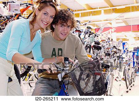 Buying a bicycle at shopping center View Large Photo Image Stock Image - Buying a bicycle at shopping center. Fotosearch