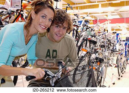 Buying a bicycle at shopping center View Large Photo Image Stock Image - Buying a bicycle at shopping center. Fotosearch
