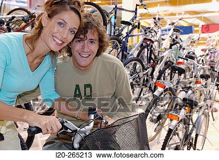 Buying a bicycle at shopping center View Large Photo Image Stock Image - Buying a bicycle at shopping center. Fotosearch
