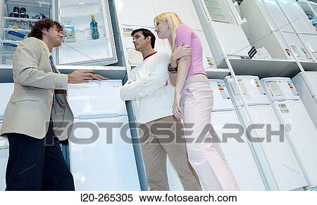 Stock Photography - Buying a refrigerator. Fotosearch