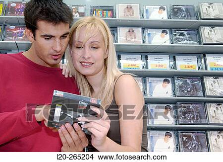 Buying music CD at shopping center View Large Photo Image Picture - Buying music CD at shopping center. Fotosearch