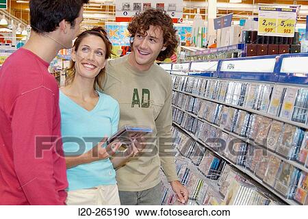 Buying music CD at shopping center View Large Photo Image Stock Image - Buying music CD at shopping center. Fotosearch