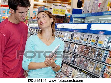 Buying music CD at shopping center View Large Photo Image Stock Image - Buying music CD at shopping center. Fotosearch