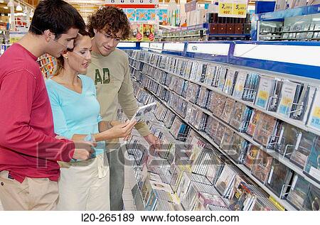 Buying music CD at shopping center View Large Photo Image Stock Photo - Buying music CD at shopping center. Fotosearch