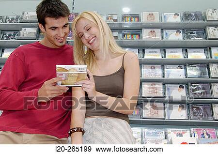 Buying music CD at shopping center View Large Photo Image Stock Photo - Buying music CD at shopping center. Fotosearch