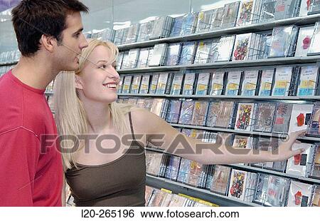 Buying music CD at shopping center View Large Photo Image Stock Photograph - Buying music CD at shopping center. Fotosearch