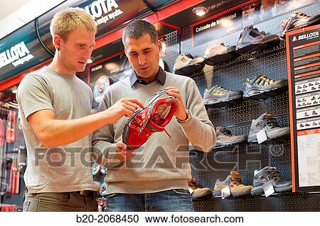 Buying protective boots. Hardware store. View Large Photo Image Stock Image - Buying protective boots. Hardware store.. Fotosearch