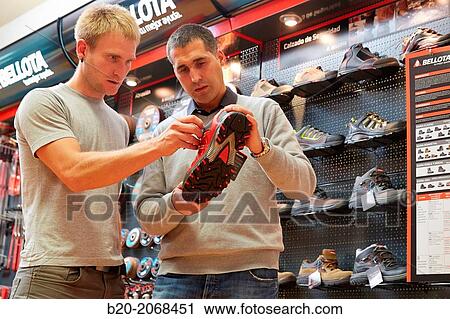 Buying protective boots. Hardware store. View Large Photo Image Stock Image - Buying protective boots. Hardware store.. Fotosearch