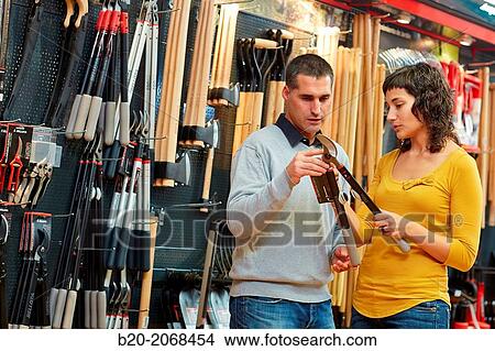 Buying pruning shears. Hand tools for agriculture and garden. Hardware store. View Large Photo Image Picture - Buying pruning shears. Hand tools for agriculture and garden. Hardware store.. Fotosearch