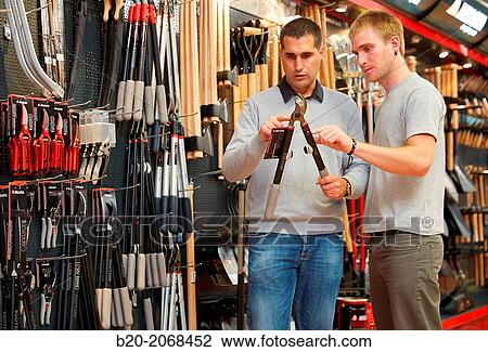 Buying pruning shears. Hand tools for agriculture and garden. Hardware store. View Large Photo Image Stock Image - Buying pruning shears. Hand tools for agriculture and garden. Hardware store.. Fotosearch
