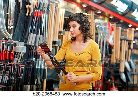 Buying pruning shears. Hand tools for agriculture and garden. Hardware store. View Large Photo Image Stock Photo - Buying pruning shears. Hand tools for agriculture and garden. Hardware store.. Fotosearch
