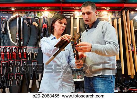 Buying pruning shears. Hand tools for agriculture and garden. Hardware store. View Large Photo Image Stock Photography - Buying pruning shears. Hand tools for agriculture and garden. Hardware store.. Fotosearch